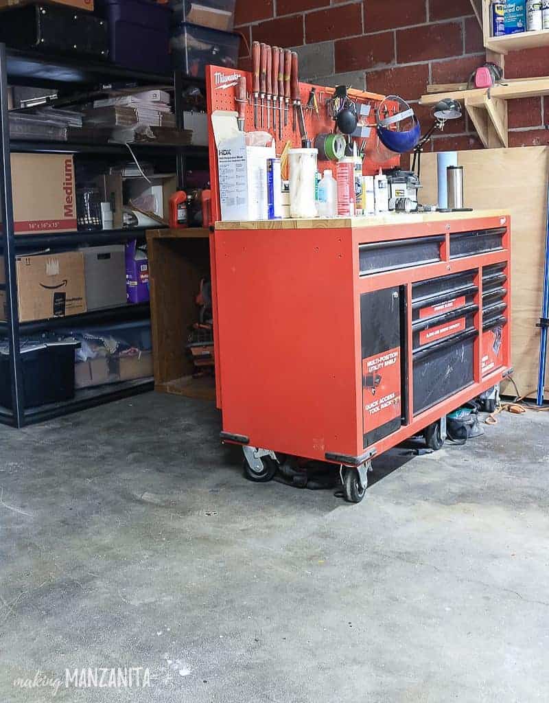 There's plenty of room in the garage to place a locking storage cabinet next to our tool and work bench