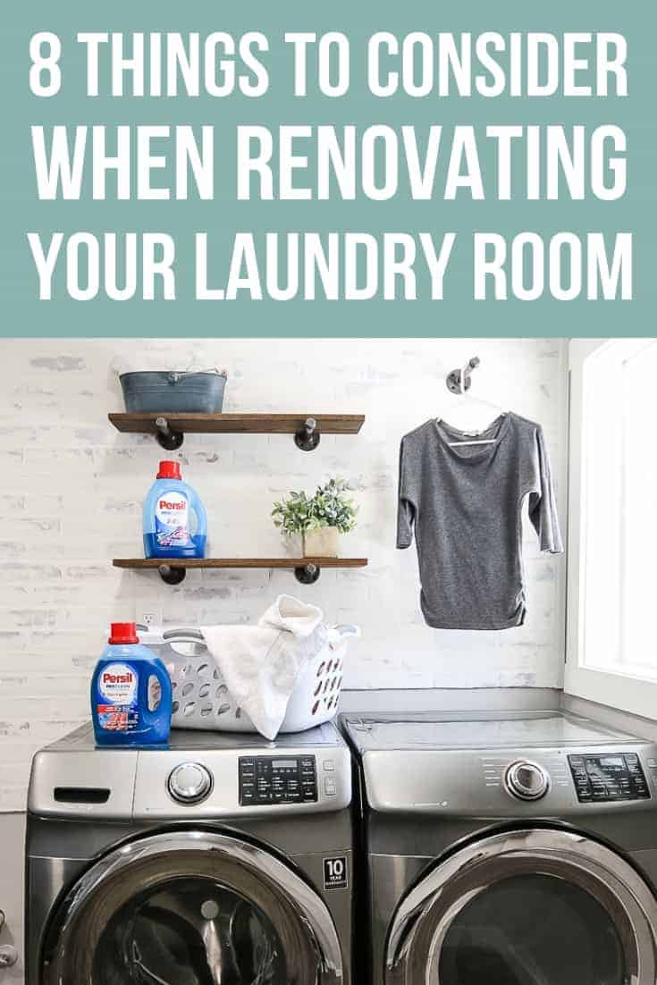 Farmhouse style laundry room with faux brick wall and industrial wood shelves with 2 bottles of Persil laundry detergent, a faux plant, metal bucket and white laundry basket full of clothes sitting on the shelves & washer and dryer with a gray shirt hanging on a hook on the wall with text overlay that says 8 things to consider when renovating your laundry room