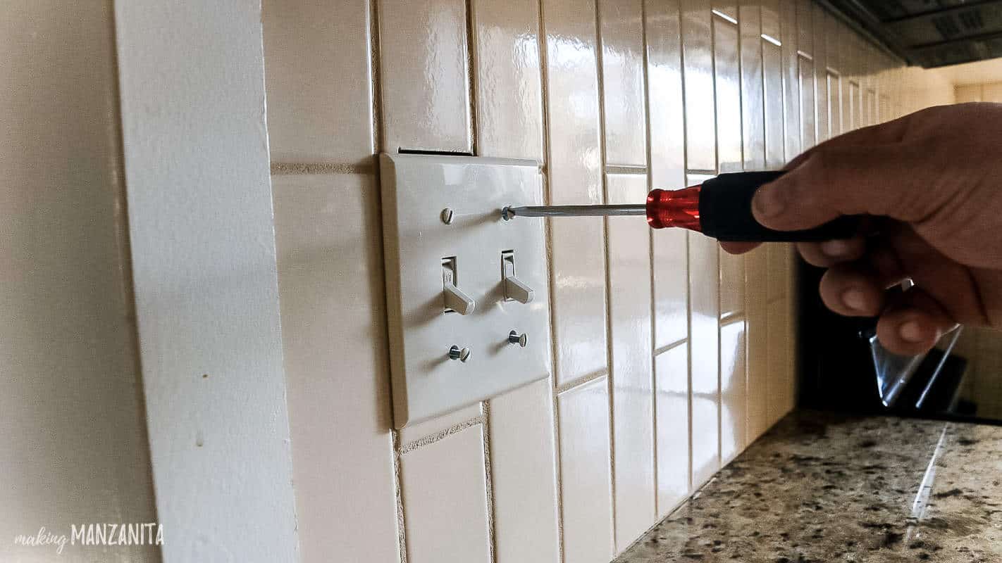 Before removing tile backsplash, make sure to remove all light switch panels
