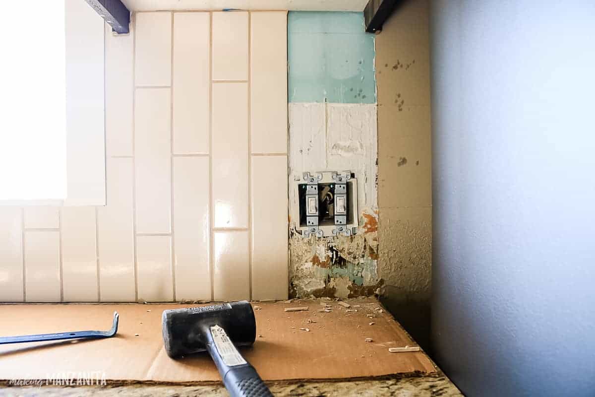 Removing tile backsplash in the kitchen is messy work, so make sure to prep the area well