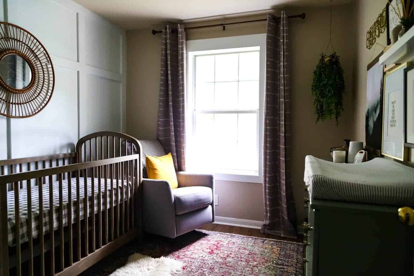 Moody neutral nursery with board and batten and contemporary decor