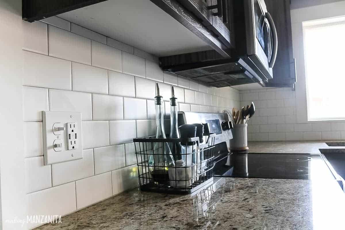A modern farmhouse style subway tile backsplash was installed in our kitchen, freshening up and brightening up the look!