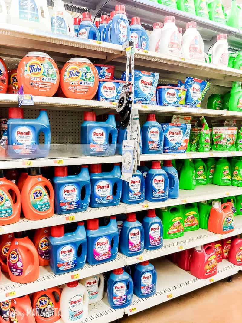 Aisle full of laundry detergents in Walmart with Persil in the middle 