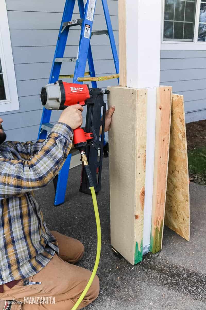 Adding siding to DIY porch posts with nail gun to add curb appeal