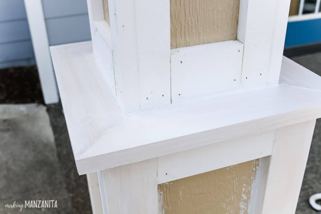 Primed surfaces of wood trim added to a farmhouse style porch posts