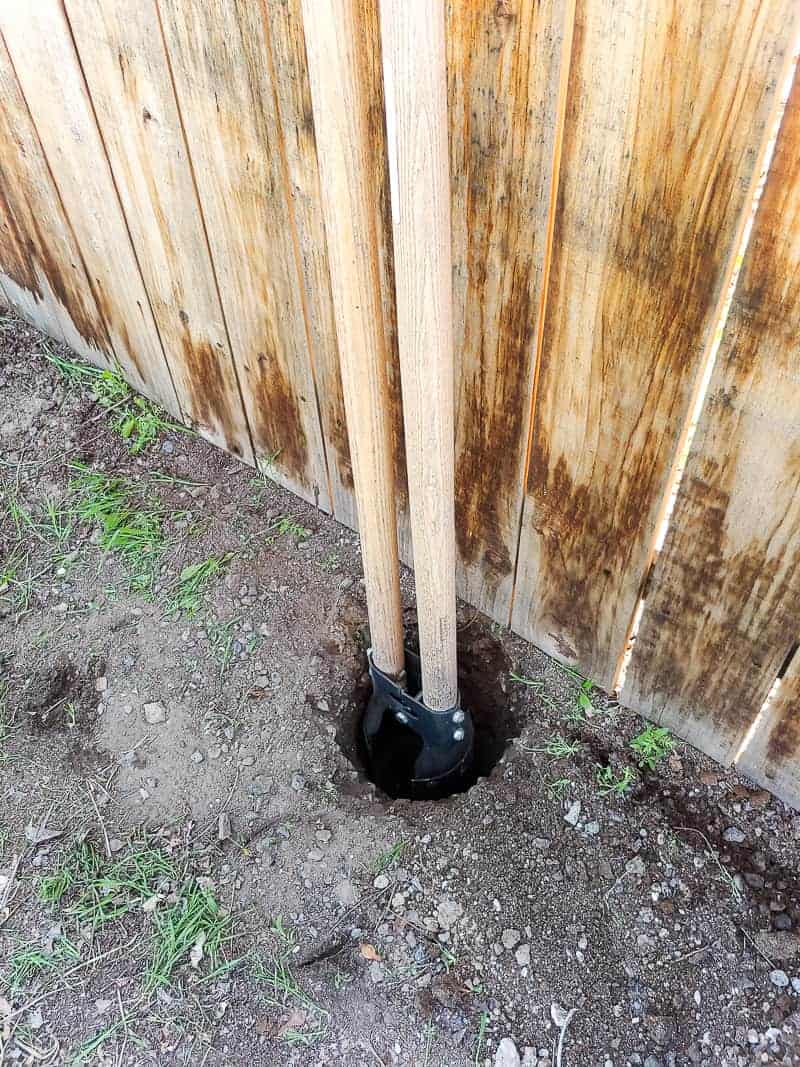 Use a post hole digger to dig out holes for the posts that support the outdoor chalkboard storage box.
