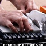Man cutting tile on a wet tile saw with text overlay that say read this before you buy a cheap tile saw