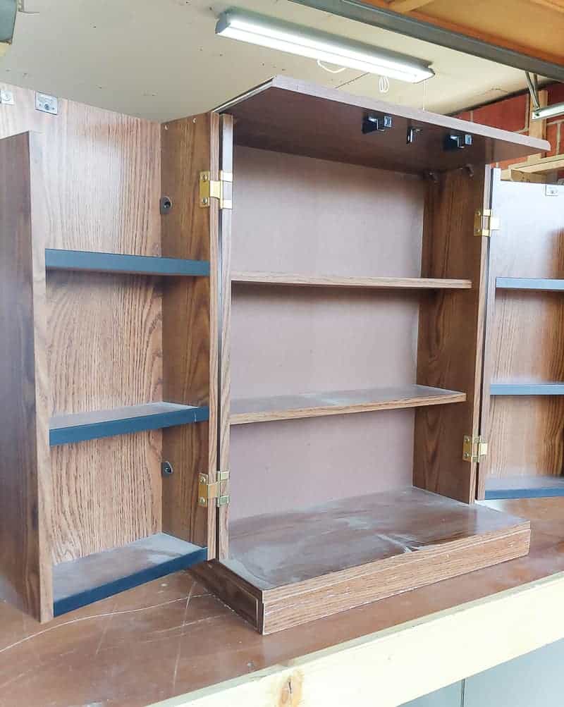 Full image of laminated cabinet makeover with open doors showing the inside