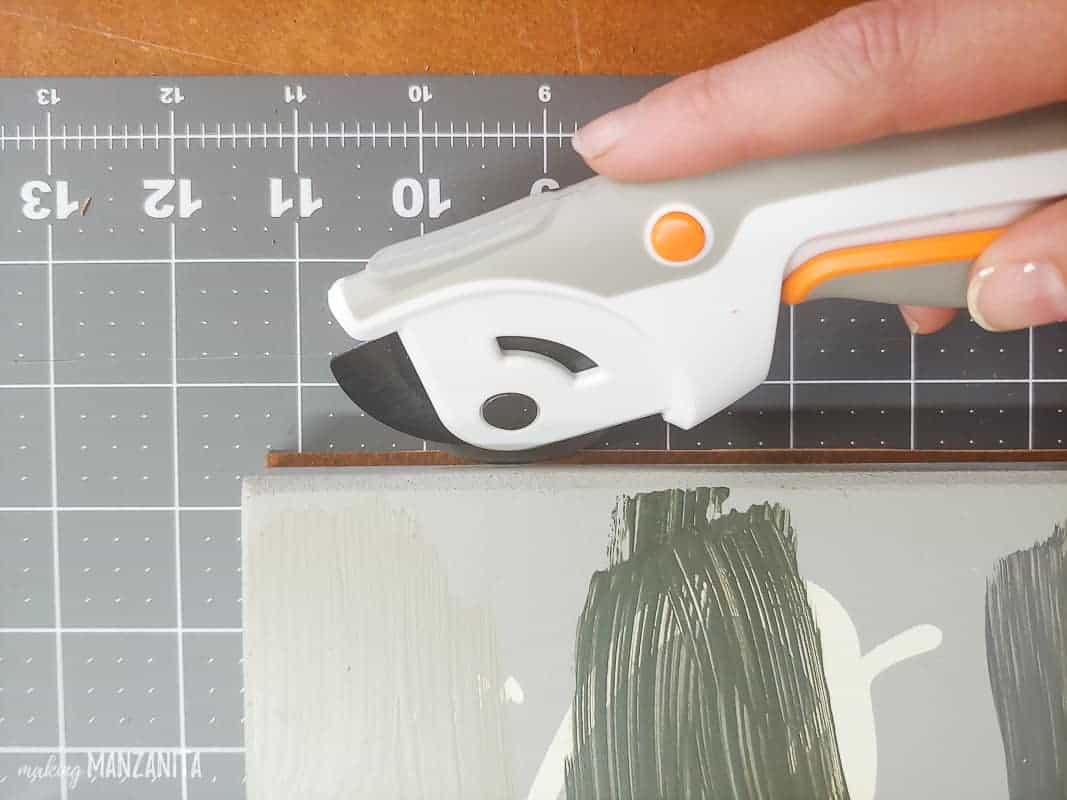 Cutting the the leather scrap to the right size using a rotary knife