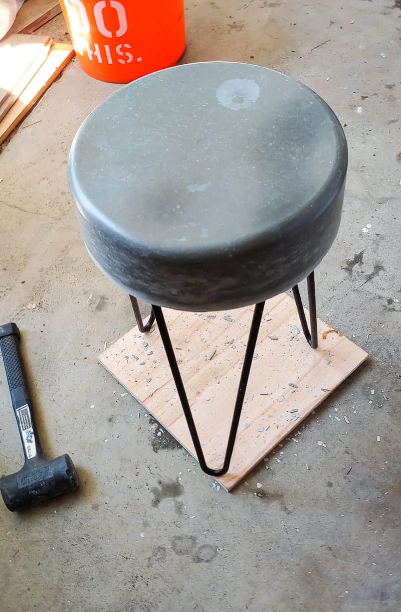 The unfinished concrete patio table with hairpin legs, ready to be sealed and finished