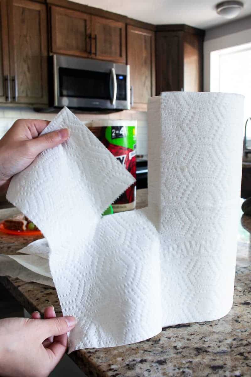 Tearing pieces from the paper towel roll