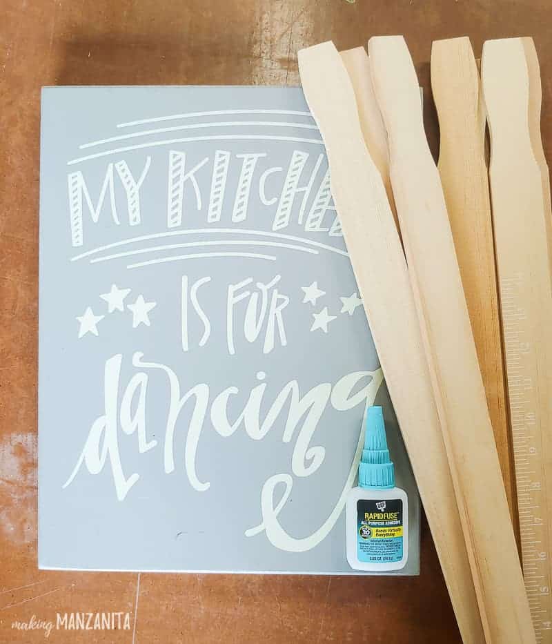 See how I used a thrifted sign, some paint sticks, and glue to create a DIY key holder for my home