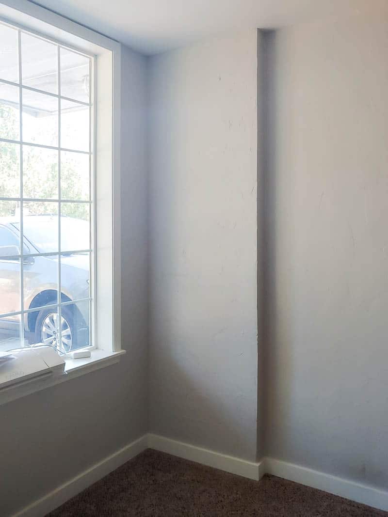 Corner view of the small entryway space before getting a makeover 