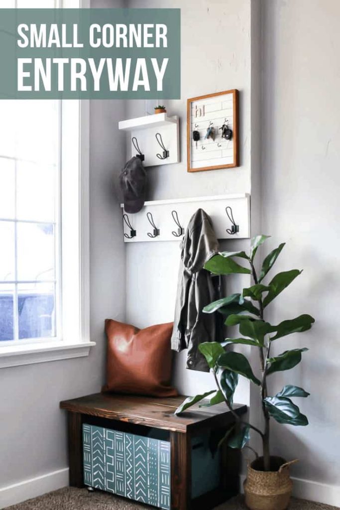 Entryway design which includes coat racks, key holder, leather pillow, wooden bench, wooden shoe storage and indoor plant with text overlay that says Small Corner Entryway