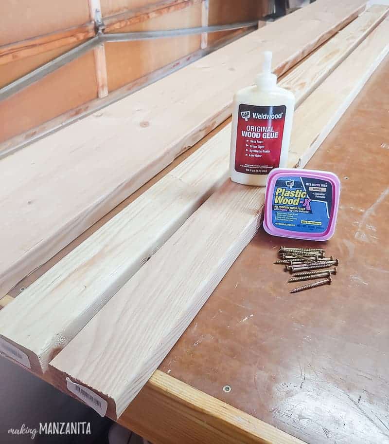 Supplies for bench laying on workbench - wood, wood filler, wood glue