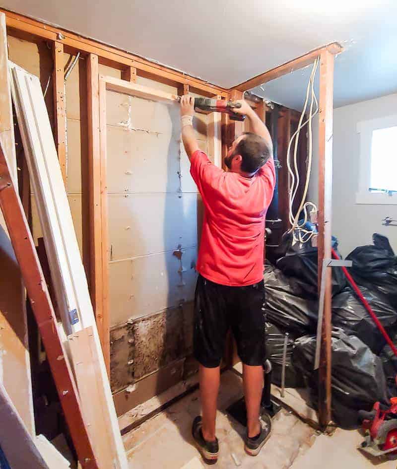 During our bathroom renovation, Logan had to cut a new doorway leading into our master bedroom - we cut this doorway in the demo'd bathroom where the shower used to be.
