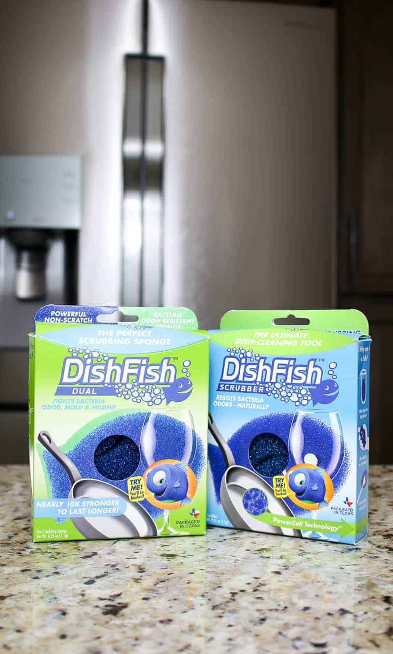 Two DishFish scrubber on the countertop in front of fridge