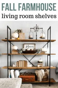 Picture of a shelves with a text fall farmhouse living room shelves with text overly fall decorated shelves