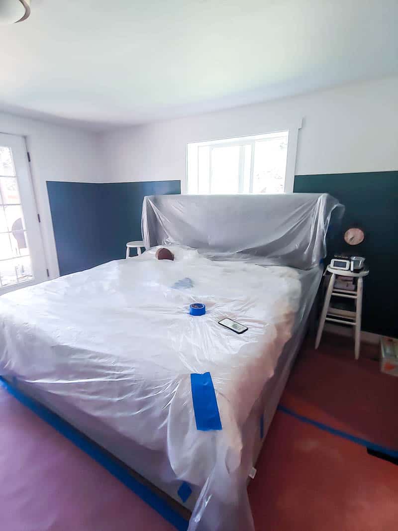 Our master bathroom - protecting the king size bed with plastic during construction.