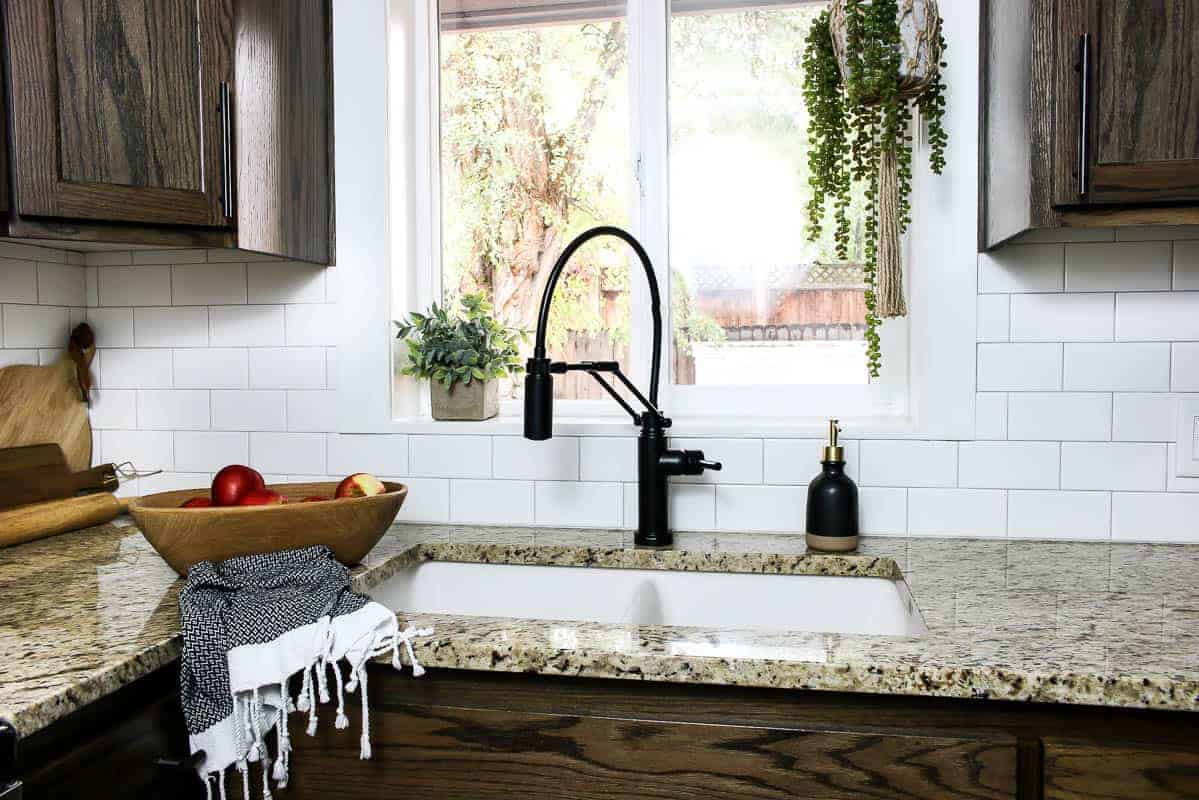 Finished undermount sink installation with granite countertops