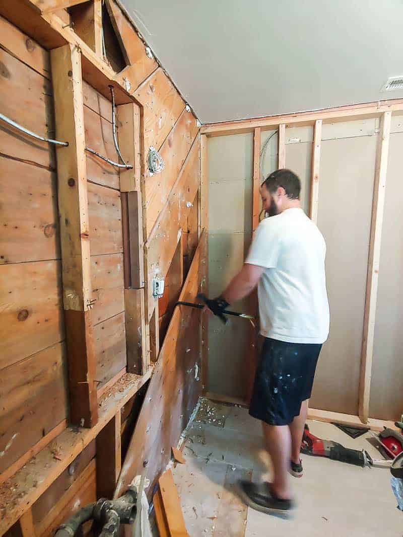 During our bathroom renovation, we removed the wood bathroom wall to create a new bathroom door leading into our master bathroom.