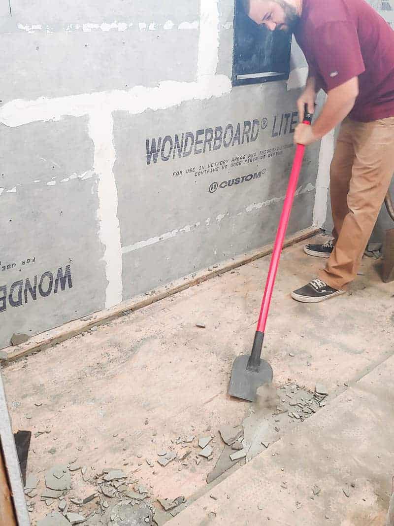 Removing the old shower pan cement floor during our bathroom renovation