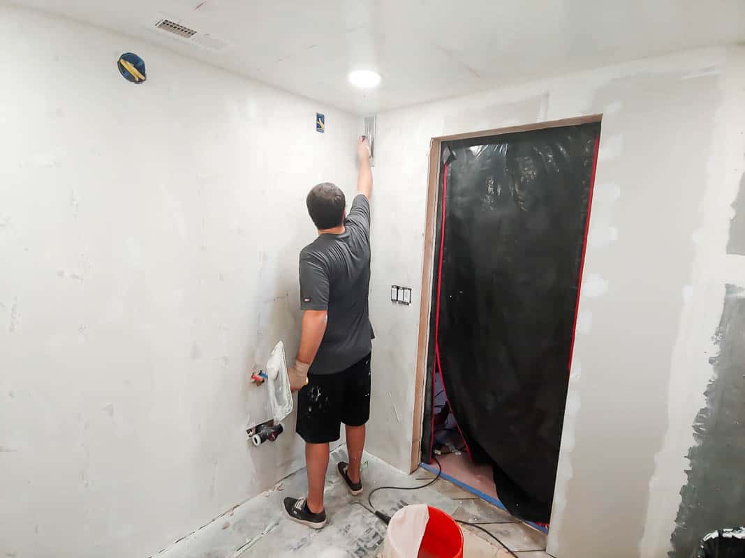 During our bathroom renovation, we got the walls set up with dry wall, all primed and painted