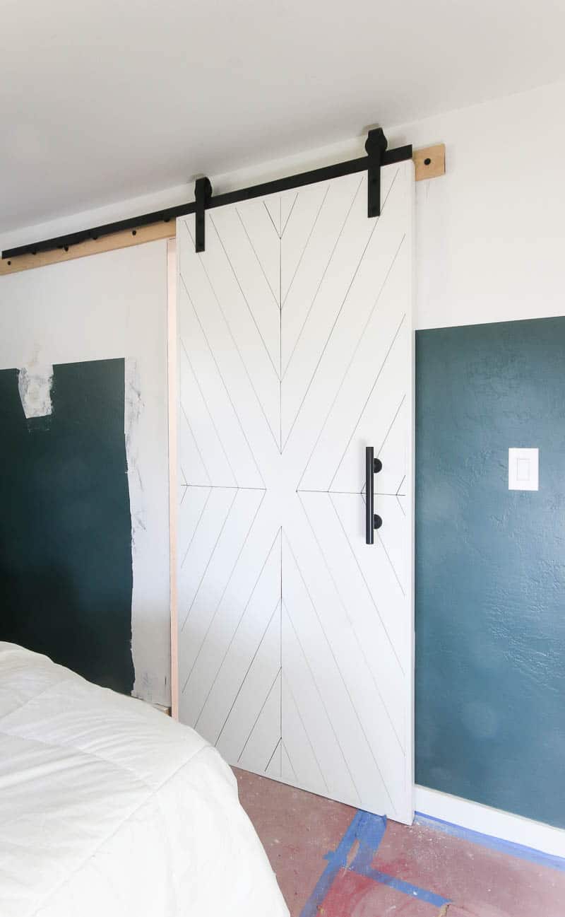 This modern farmhouse style sliding barn door looks great in our master bedroom.