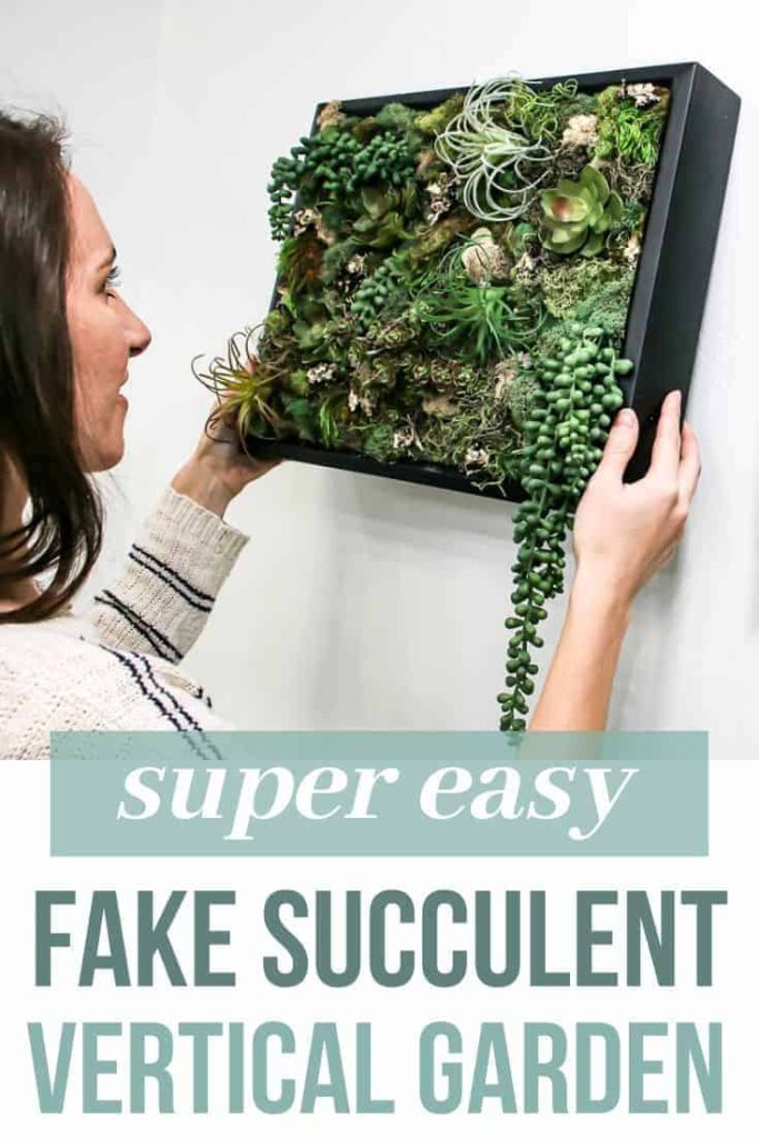 A photo of Chelsea hanging the succulent wall decor on the wall, with text overlay that reads "super easy fake succulent vertical garden"