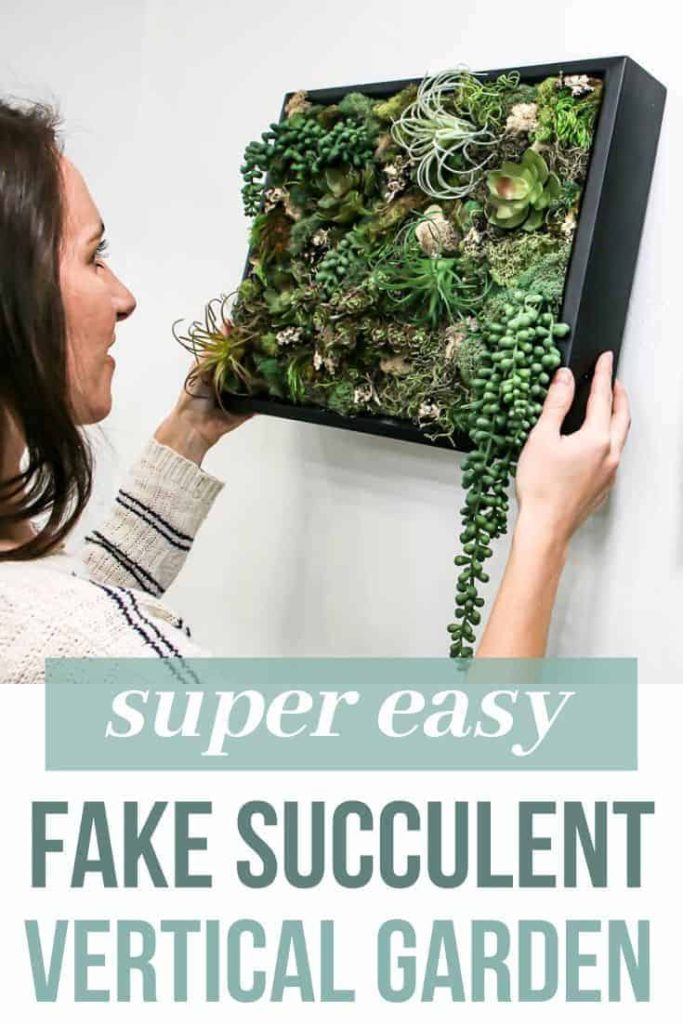 A photo of Chelsea hanging the succulent wall decor on the wall, with text overlay that reads 