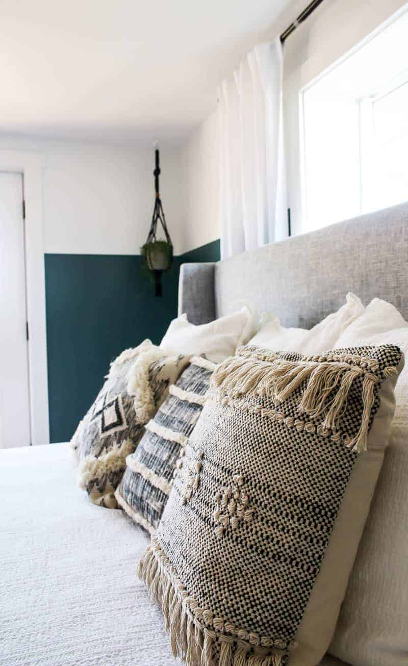 An up close look at our green boho bedroom style throw pillows - I love the woven texture of these throw pillow covers, and the modern Aztec patterns.