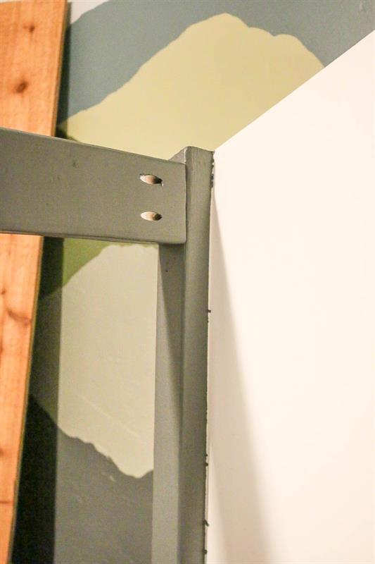 Detail of pocket hole joinery on DIY cabin bed for little boy's room that looks like a house