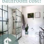 It is a picture of the bathroom with white tile flooring and white walls. There are black window panels for the shower.