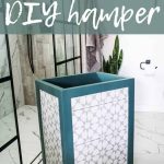 Laundry hamper with teal trim and gray and white tile sitting in a white bathroom with tile flooring and white walls. Text says how to build a diy hamper