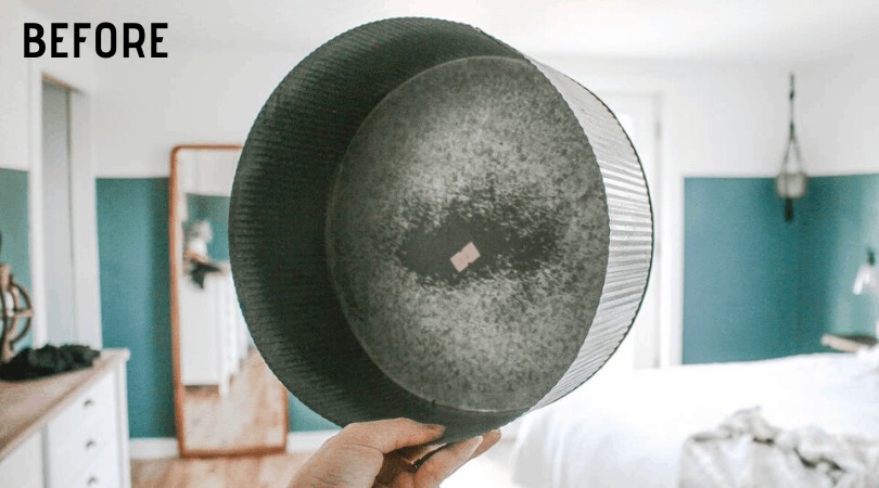 A round galvanized metal basket ready to be transformed into a round wall planter