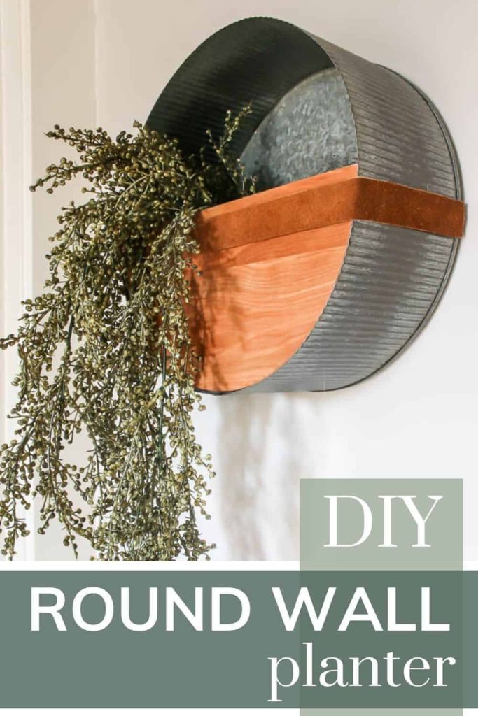 How to make a DIY round wall planter from a galvanized metal bin and some spare wood.