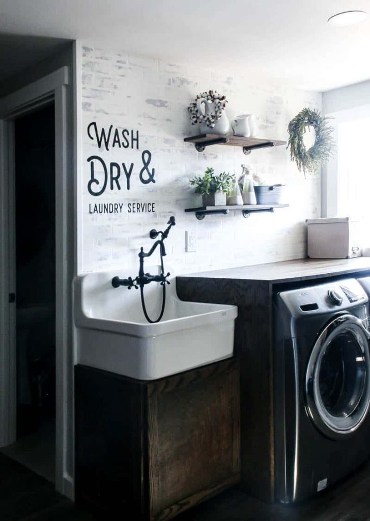 A look at the finished wall stencil, painted on the laundry room wall. This wall stencil gives my farmhouse style laundry room a more authentic touch.