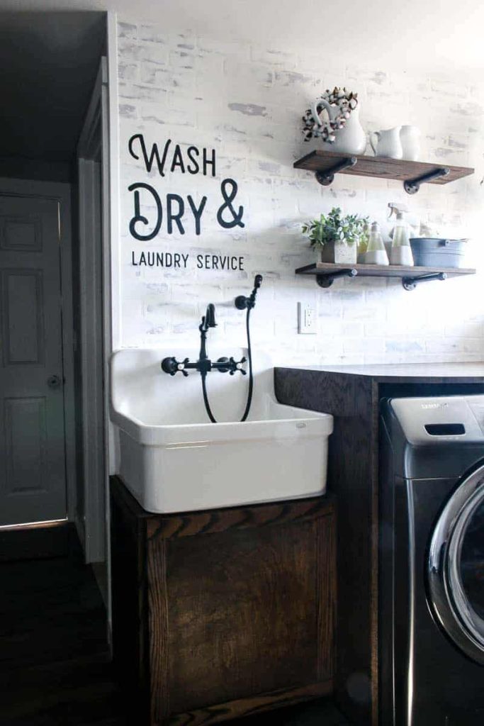 The completed wall stencil painted on the faux brick wall over our laundry room sink.