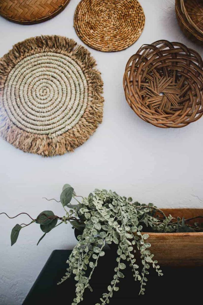 Use different types of wicker baskets to add different textures and tones to your wicker basket wall decor