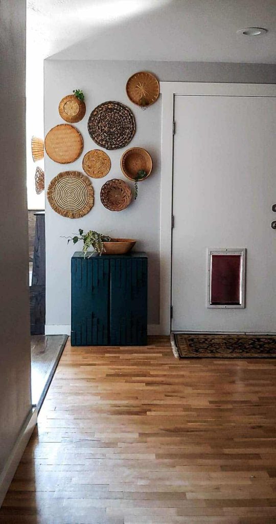 How to create a boho-inspired wicker basket wall with different size and shapes of thrifted wicker baskets