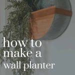 Side view of the modern metal wall planter on a white wall and long green vines hanging from it. Overlay text says how to make a wall planter on a budget