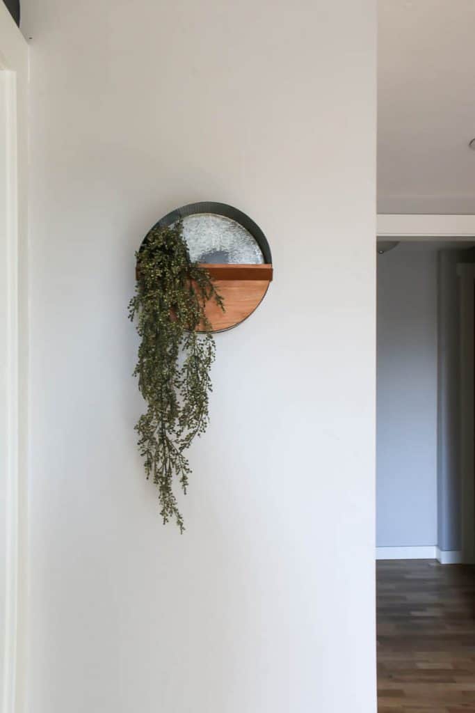This round wall planter looks great hanging on the wall with some faux greenery