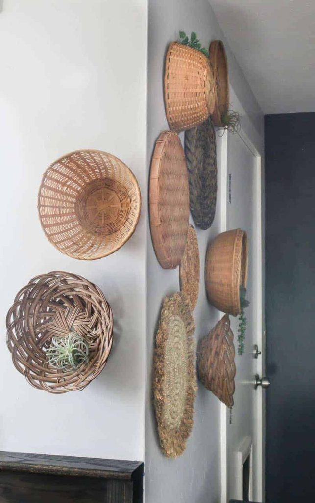 This diy wicker basket wall wraps around the corner of the room, which is a unique detail