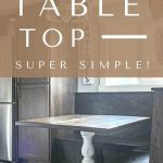 Shows a farmhouse kitchen with wood cabinets, wood breakfast nook, wood table with white stand, wood floors, and metal refrigerator with overlay texts says diy table top, super simple