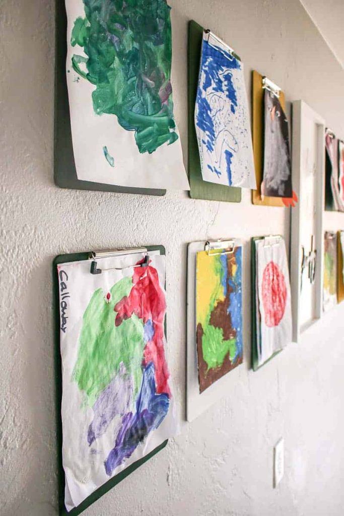 show off your child's paintings with this easy to DIY clipboard gallery wall