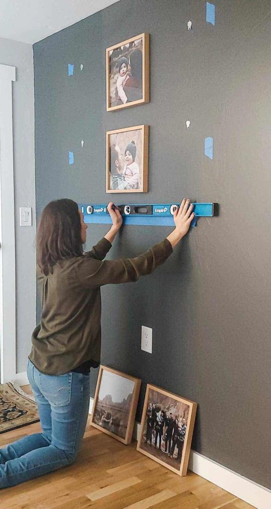 How to create a grid gallery wall using painter's tape, a level, and wood picture frames