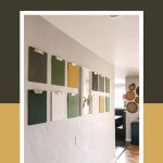 shows 12 gray, green, white, and yellow clipboards on a gray wall with a white live life simply frame in between the clipboards with text at top that says how to hang a clipboard wall
