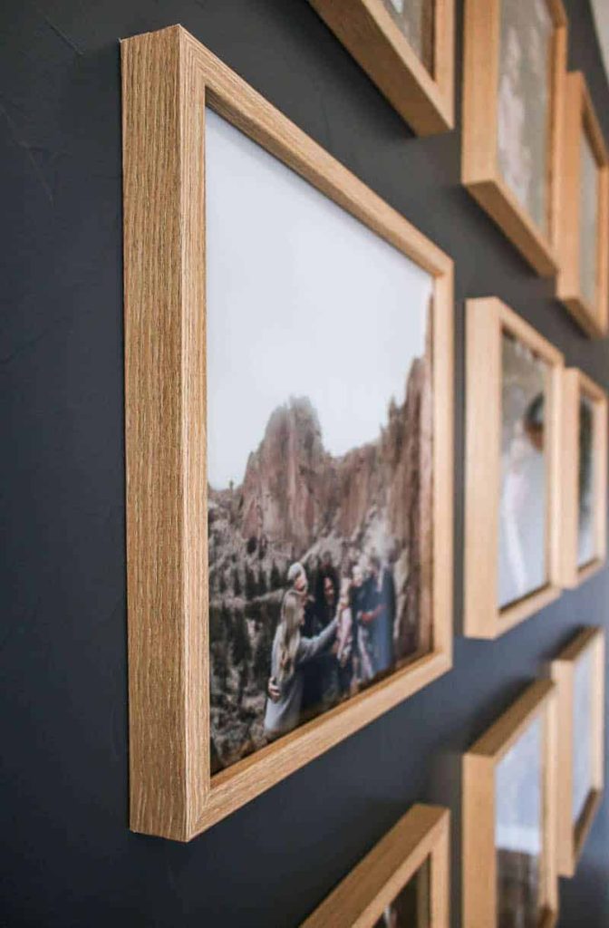 A 3 by 3 grid gallery wall with wooden frames