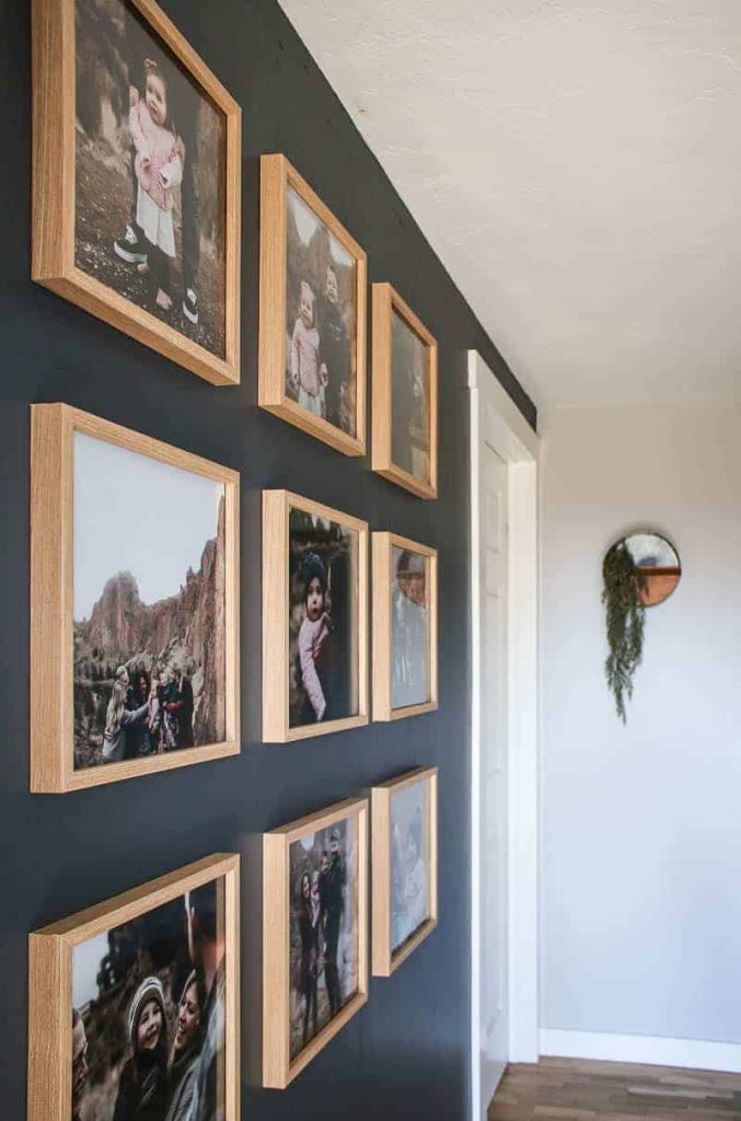 A side view of a grid gallery wall, created with 9 wood picture frames ina  grid pattern