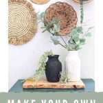 shows a black and white vintage looking vases siting on a wood plank and teal cabinet with greenery hanging out of them with a wicker basket wall in the background with overlay text that says Make your own vintage pottery